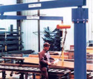 Jib cranes are for sale at AMCHoist. This includes workstation, I-Beam, and Articulating jib cranes. Jib crane set up in a warehouse for easy transportation of heavy materials.